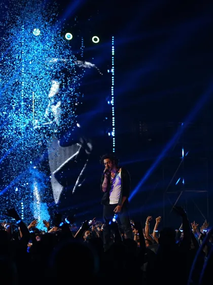 A shot from the 'Saiyaara' concert scene, with blue lighting and confetti creating a celebratory and high-energy moment.
