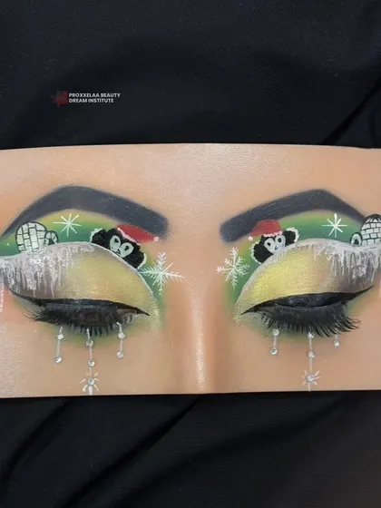 A full view of the adorable penguin and igloo eye makeup, a perfect example of the fun and creative skills learned in our courses.