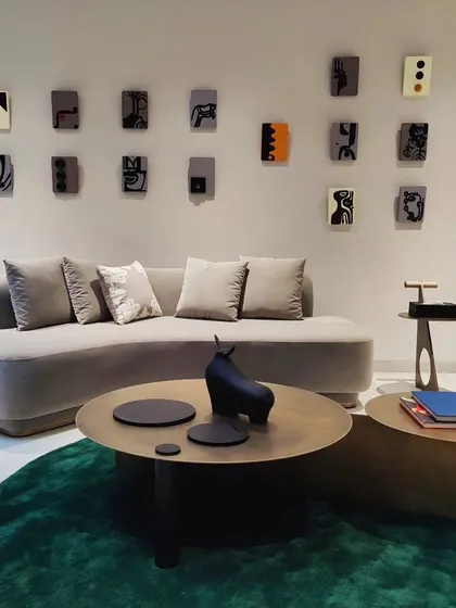 The completed installation in Hyderabad, a gallery wall of miniature abstract narratives that animate the space.