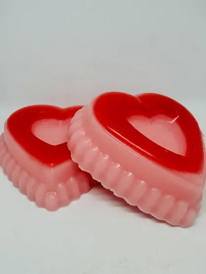A close-up of my two-toned, heart-shaped soaps, perfect for Valentine's gifting. Each bar is handmade with care to be both beautiful and gentle on the skin.