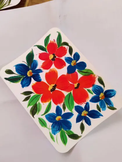 A simple composition of red and blue flowers. The high contrast makes this little painting pop.