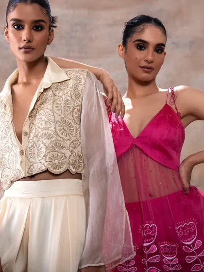 A dual-model shot for Akashi Clothing. I ensured the makeup looks were harmonious, with a focus on defined eyes and a neutral palette to suit the different colored outfits.