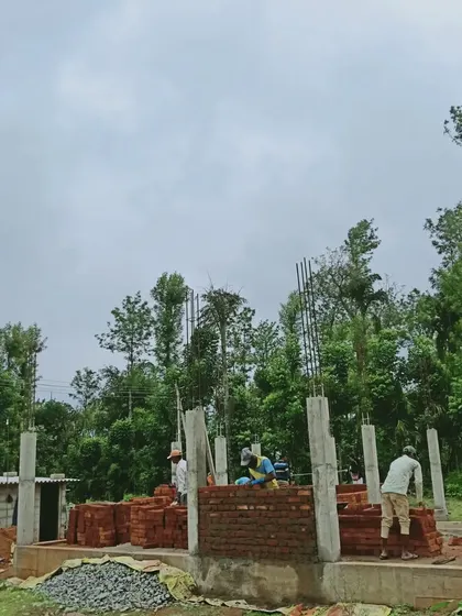 Another view from the Sriyani residence site visit, showing the structure beginning to take shape against the beautiful natural backdrop of Coorg. This project is about creating a home that is in harmony with its environment.