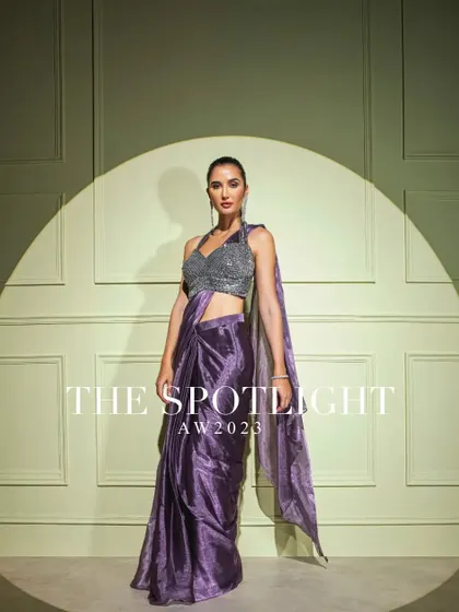 From my "Spotlight" collection, this metallic purple drape saree is paired with a silver sequined halter blouse for a show-stopping party look.