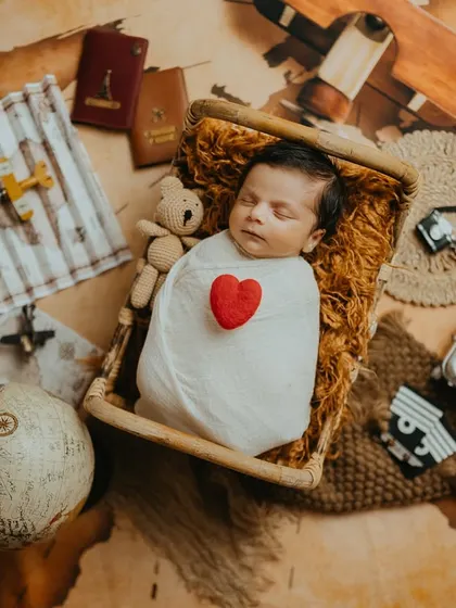 Another angle of the newborn traveler, peacefully dreaming of all the places he'll go.