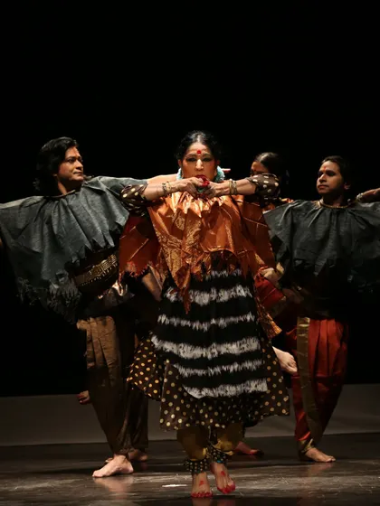 A powerful pose from 'Antariksha Sanchar', a production celebrating the dream of flight. The choreography blends the martial grace of Chhau with the precision of Bharatanatyam to create a unique movement vocabulary.