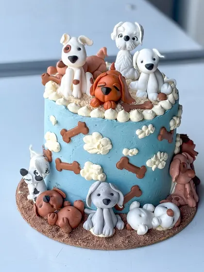 This cake is one of my all-time favorites, made for a true dog lover. It features a variety of handmade fondant dog figurines, each with its own personality, sitting on and around a buttercream cake. It’s a perfect example of how we can turn your passion into a delicious piece of edible art.