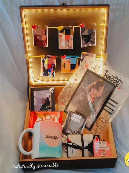 Another angle of the "You are my Person" hamper, showing the arrangement of the photo garland and gifts inside the light-up box.