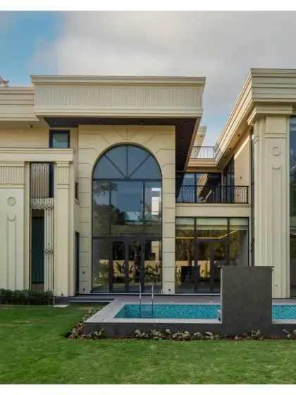 Another view of the Sultanpur masterpiece, showcasing the symmetry and elegance of the facade. The design includes a private pool that is perfectly integrated with the home's classical architecture and manicured lawn.