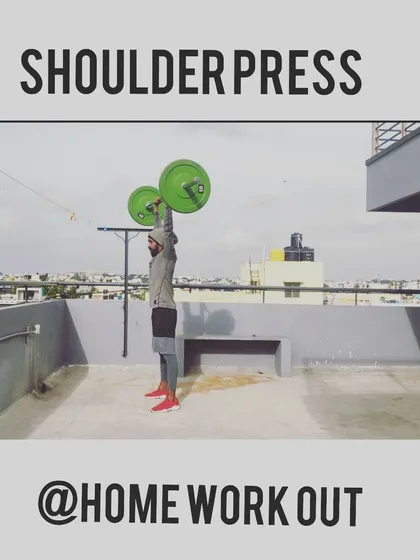 You don't always need a gym to get strong. This is me doing a shoulder press with a barbell during a home workout on my terrace. I can design effective personal training programs that you can do anywhere.