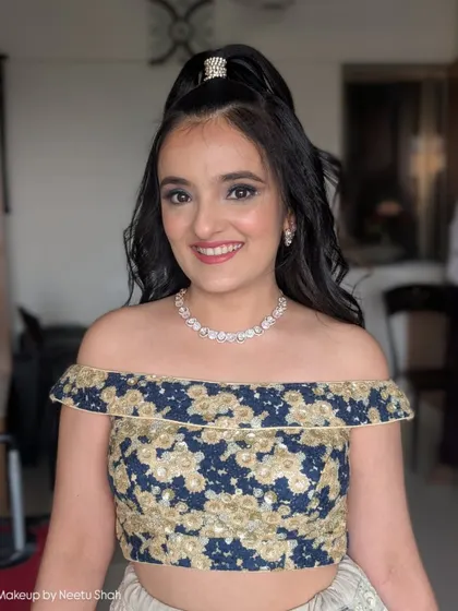 Fun and flirty glam for a party. This look features a classic smokey eye and a high, bouncy ponytail, perfect for a younger client or anyone wanting a youthful, energetic vibe.