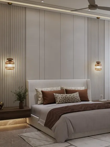 A closer look at the bed and the textured wall behind it. The muted, earthy palette of browns and beiges creates a space that is restful and quietly modern.