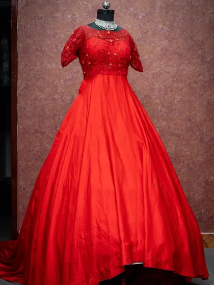 Another beautiful red gown option, this one featuring a lace-detailed bodice.