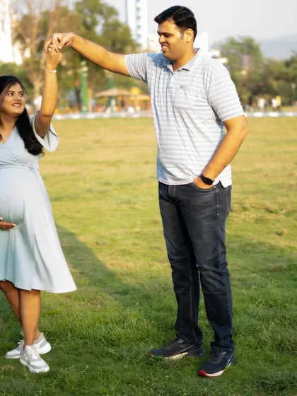 An outdoor maternity shoot allows for natural movement and fun. A playful dance in the park makes for a lovely, candid memory.