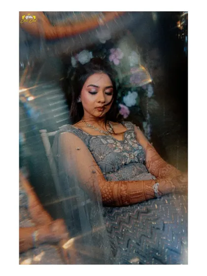 An ethereal solo portrait of the bride, Dhwnai, captured through a prism for a dreamy, magical effect.