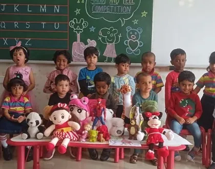 Our nursery students with their favorite toys for a special 'Show and Tell' session, learning to share and speak in front of their peers.