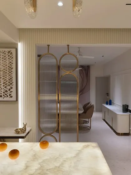 A view of the "Guilded Grace" living and dining area, showing how the different zones connect seamlessly.