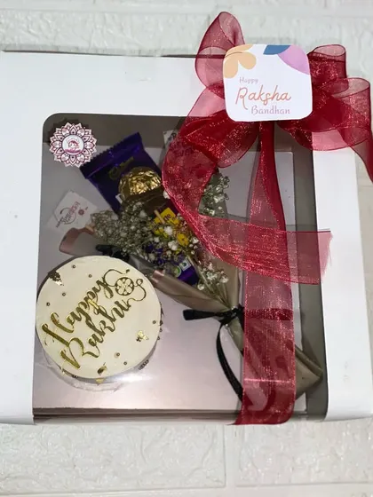 Our "Happy Rakhi" hamper, beautifully packaged with a red ribbon.