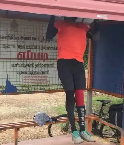 Even on a long-distance cycling trip, there's always time for a few pull-ups at a bus stop.