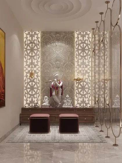 This mandir design uses intricately carved 'jaali' panels as a backdrop, which are backlit to create a divine glow. The wooden base provides storage, while the overall space is kept open and connected to the main living area through a decorative screen.
