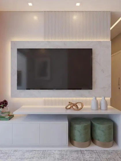 A detailed look at a clean and contemporary TV console, featuring a white marble backdrop, fluted accents, and practical storage with stylish ottomans.