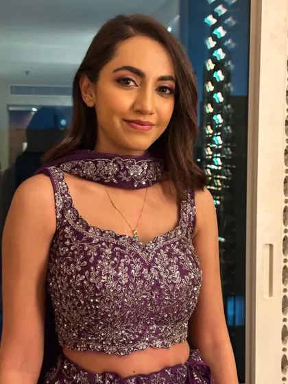 A beautiful portrait showing the full effect of the Sangeet makeup look. It's glamorous, colorful, and perfect for the occasion.