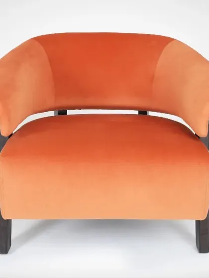 This is a catalogue-style photograph of an armchair on a seamless white background. This approach ensures the focus remains entirely on the furniture's shape, color, and texture, making it ideal for online stores.