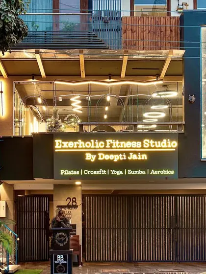 Another view of our studio's exterior at dusk. The warm lighting and clear view into the studio create an inviting and professional first impression.