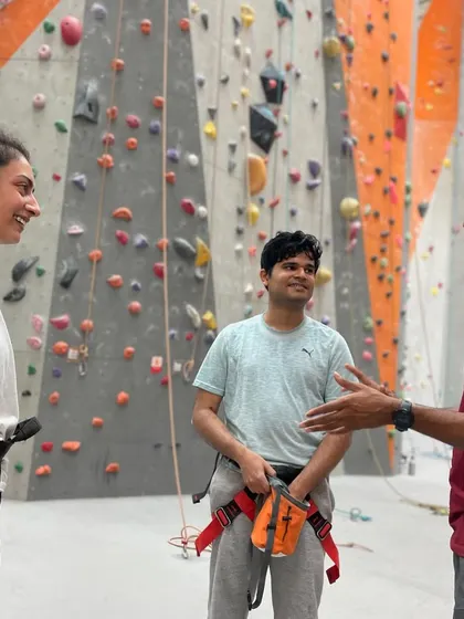 Friends laughing and chatting between climbs. Our gym is a social hub where you can connect with like minded people.