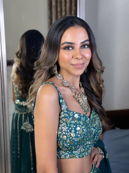 A final portrait of the stunning sangeet look. The bride looks confident, happy, and ready to celebrate.