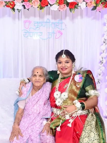 A heartwarming photo of the mom-to-be with her grandmother, capturing a precious multi-generational moment at the baby shower.