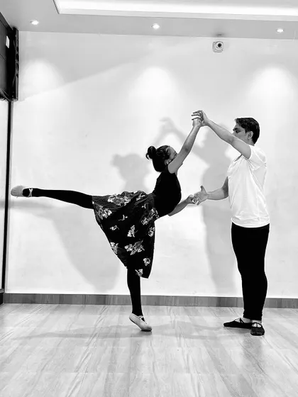 A black and white series featuring a male and female ballet dancer (ballerino and ballerina) practicing partner work. My classes include pas de deux techniques for advanced students.