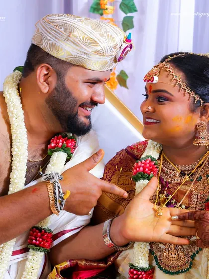 A playful and interactive moment between the bride and groom during their ceremony. We love capturing the fun and games that are part of many wedding traditions.