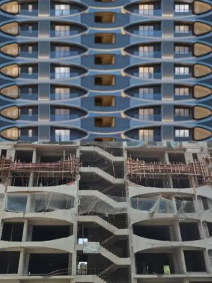 This image shows our process of turning a detailed 3D visualization into a tangible reality. The comparison highlights the precision of our design and construction management for a residential tower with a complex, undulating facade.