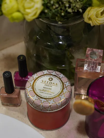 Getting ready for a Friday night out. Our Peach Bellini tin candle adds a fun, fruity, and celebratory fragrance to the room, setting the perfect mood for the weekend.