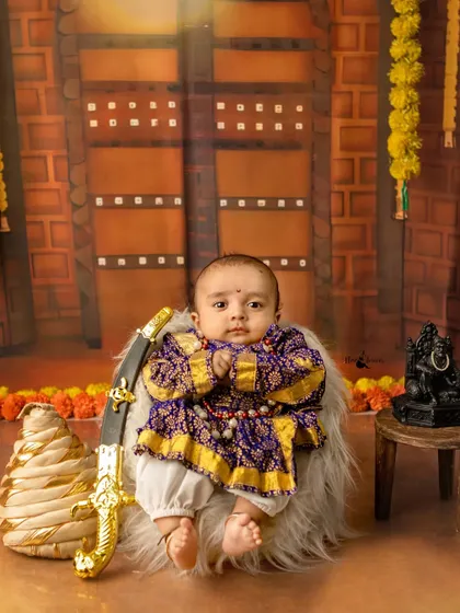 A young Mavala in the making. This little one sits with regal poise, holding a toy sword, embodying the spirit of Chhatrapati Shivaji Maharaj.