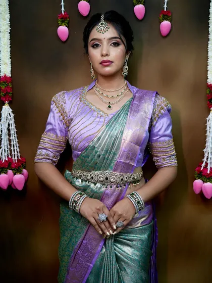 A confident, full-body pose that shows how all the elements of the outfit and jewellery come together.