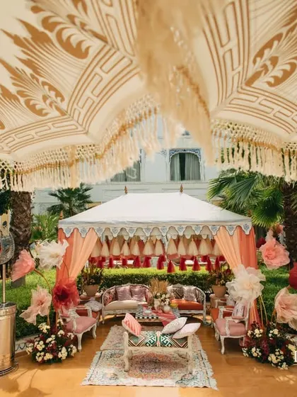An overhead view of the courtyard, showing the intricate patterns of the embroidered umbrellas and tents.