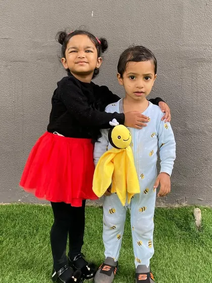 Two friends dressed up for our 'Insects' theme day. These activities foster creativity and provide a fun context for learning about the natural world.