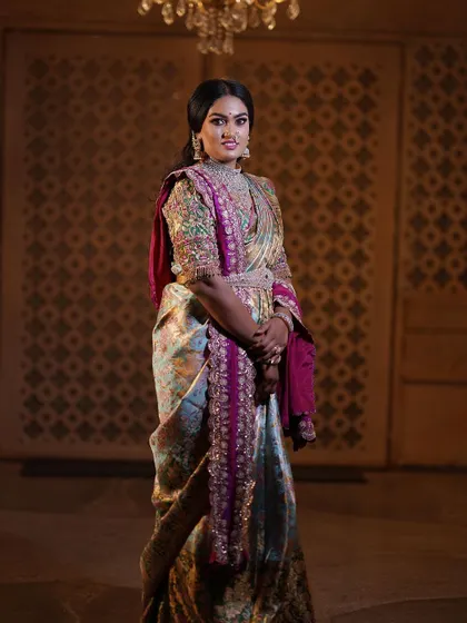 A truly royal look for this special bride. She is wearing a unique designer blouse and a beautiful saree, and we complemented it with makeup that is both regal and elegant.
