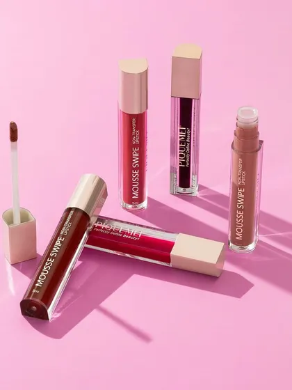 A minimalist composition featuring PiqueMei liquid lipsticks. The clean lines and soft shadows on a pink background create a modern and sophisticated look.