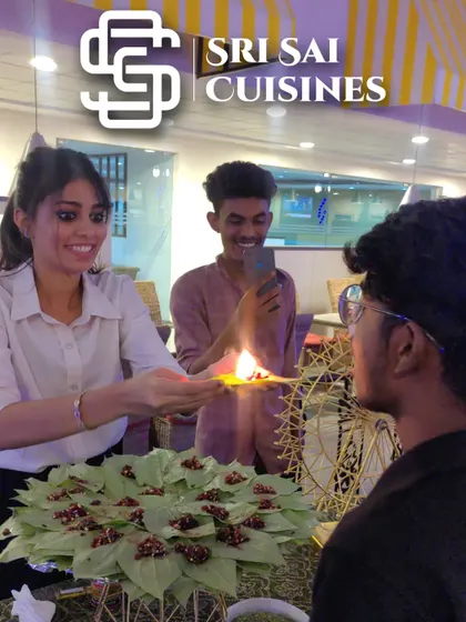A guest at a corporate event is all smiles while trying the Fire Paan. It's a fantastic icebreaker and a great way to add energy to any gathering.