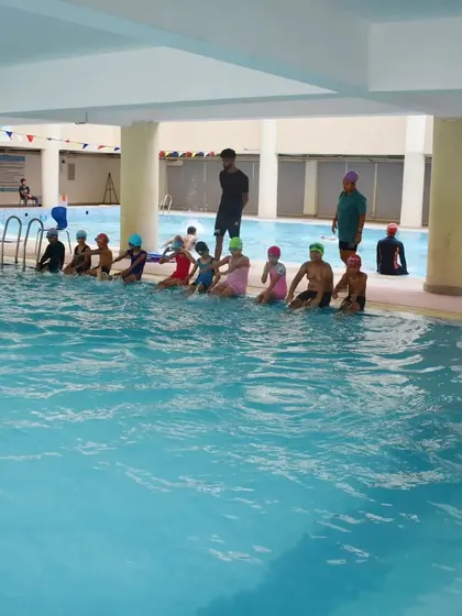 My classes are structured and organized. Students line up by the pool for instructions before starting their drills for the day.