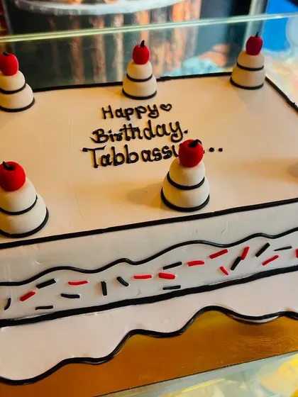 A trendy comic or vector-style cake, where black outlines create a cool 2D cartoon effect on a 3D cake.