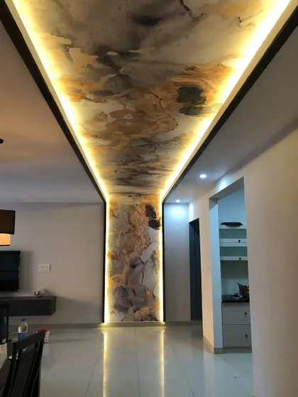 A different perspective of the ceiling installation, showing the beautiful reflection on the glossy floor.