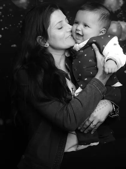 "Mummy ki Jaan." A black and white version of a mother's affectionate kiss, emphasizing the emotion and timelessness of the moment.