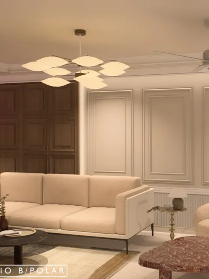 The living area of the same villa features rich wood paneling and a mix of modern and classic furniture. The design creates a warm, sophisticated atmosphere that feels both grand and inviting.