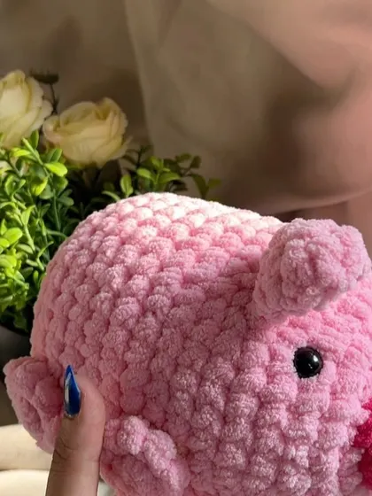Our handmade pig plushie, looking cute from the side. We ensure all our toys are well-stuffed and durable for long-lasting play and cuddles.