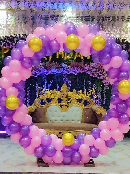 Another view of the purple and pink ring backdrop, ready for a birthday celebration.