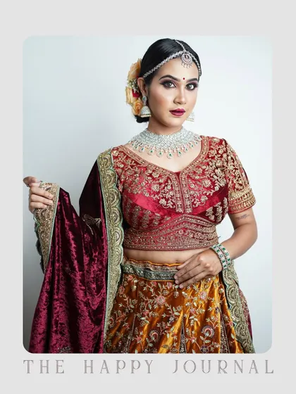 This full-length portrait highlights the beautiful details of a traditional lehenga. The studio lighting is set up to showcase the outfit's texture and color, making it a great shot for a model's portfolio or a clothing brand collaboration.